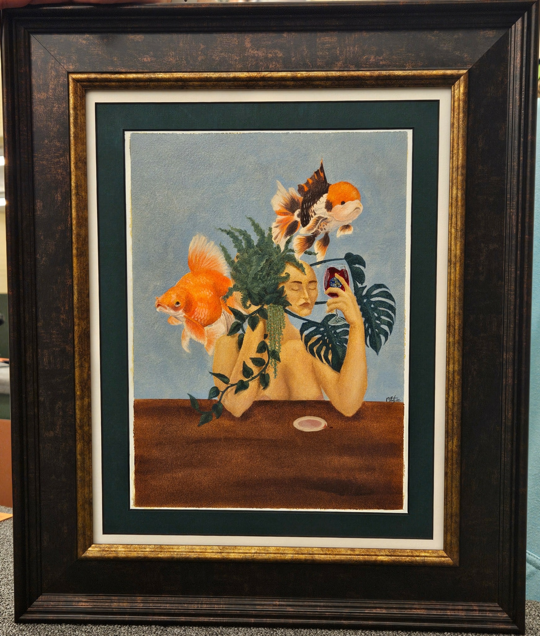 Person with fish and plant elements on face, holding phone, with fish swimming around head, in a framed painting.