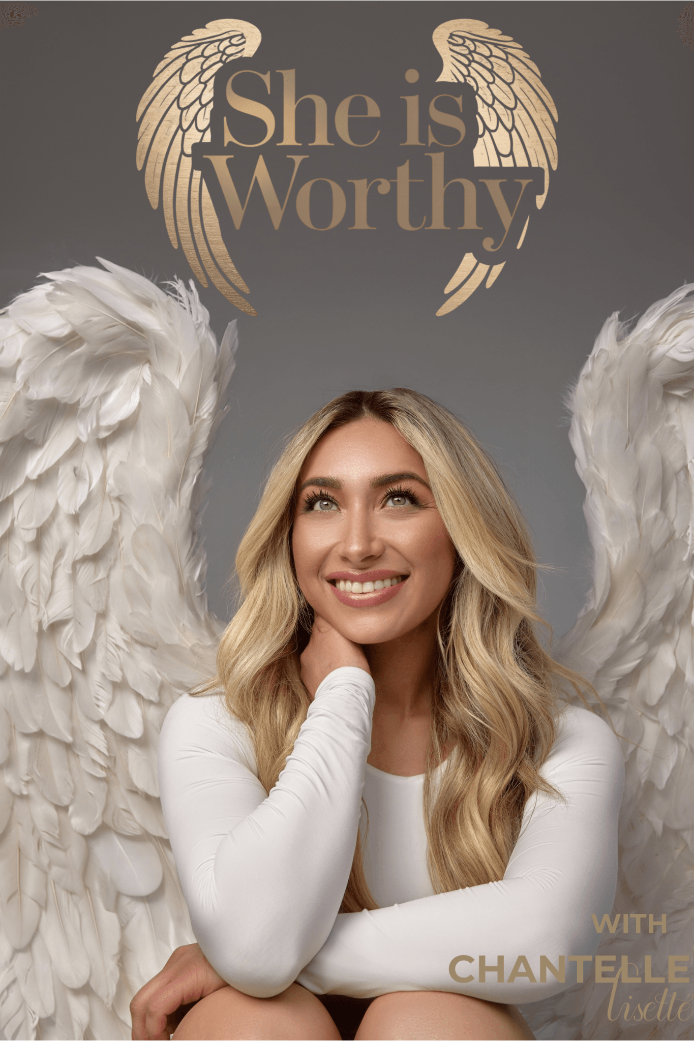 Smiling woman with long blonde hair and white wings, with gold wings and text 'She is Worthy' above her.
