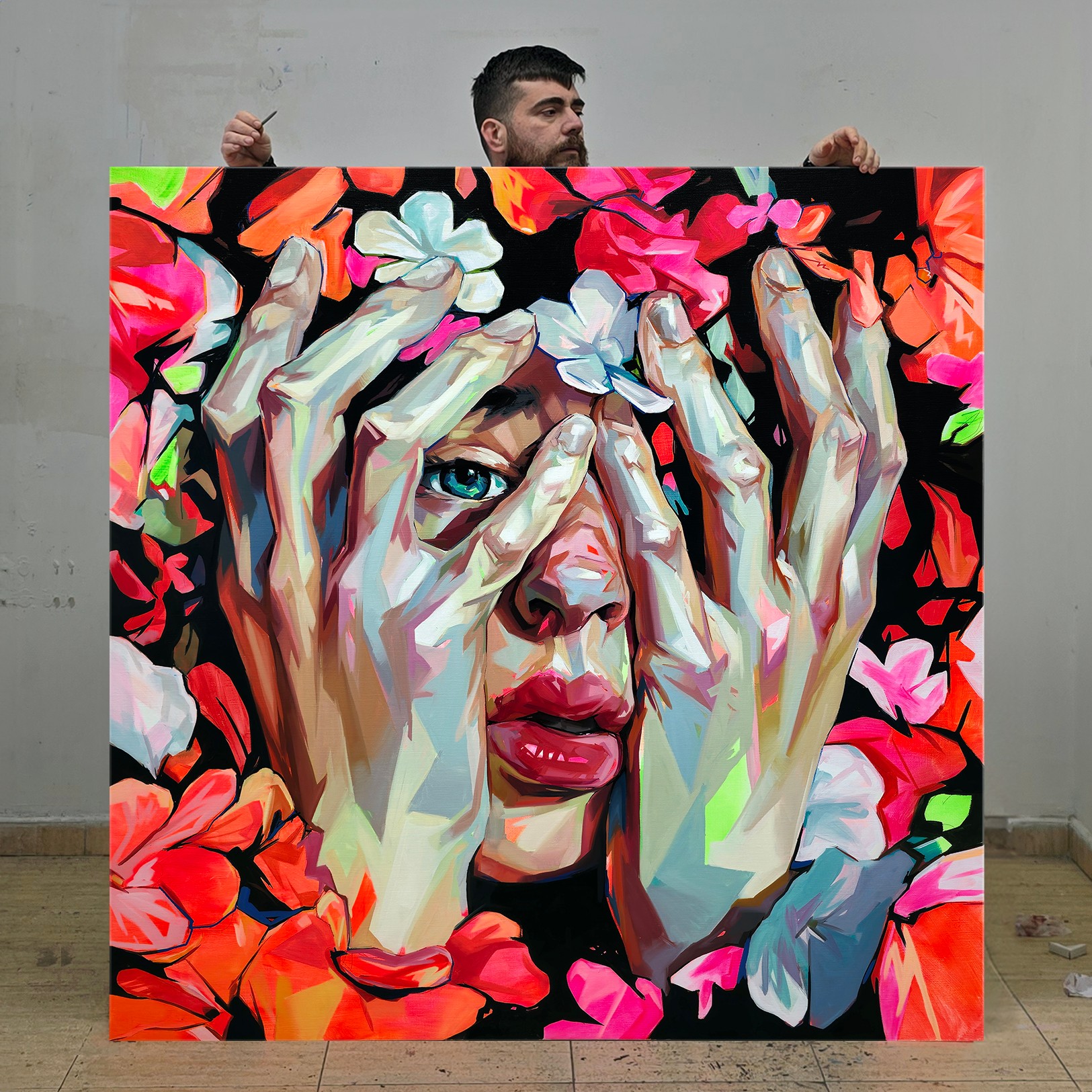 A colorful painting of a woman with hands covering her face, surrounded by vibrant flowers, with a man holding it behind.