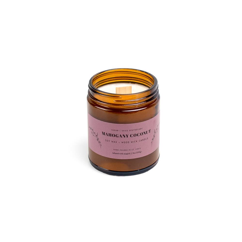 Open amber glass jar with pink label, no lid, on a white background.