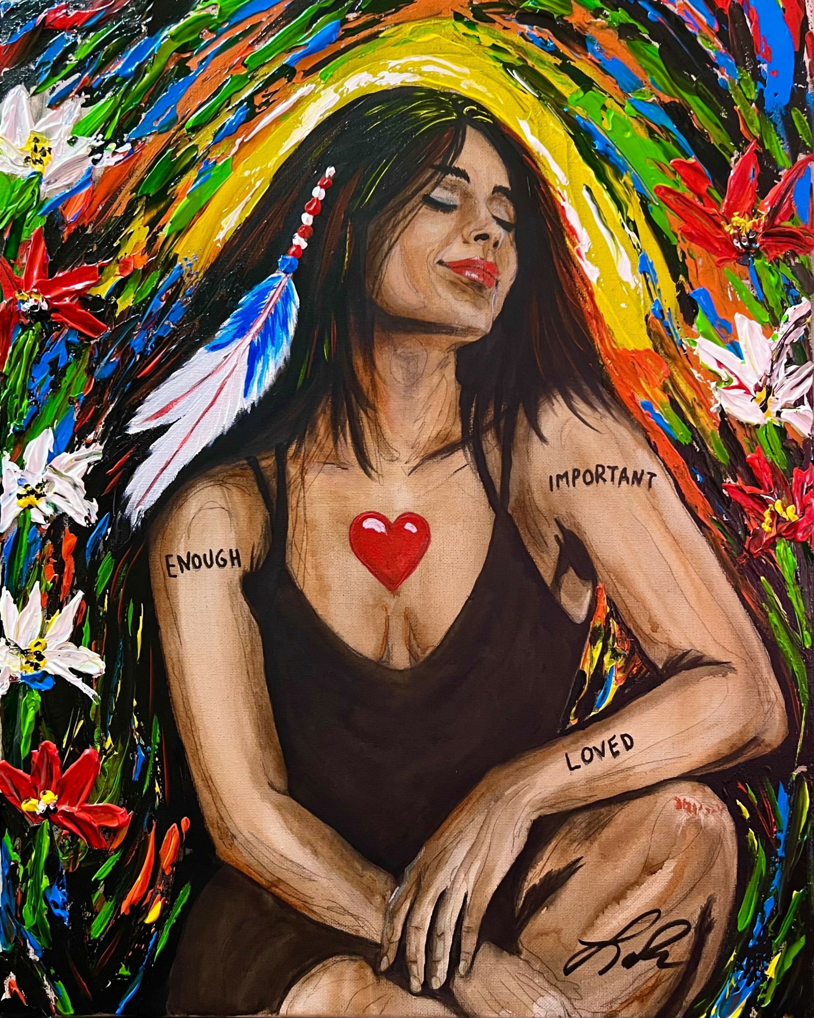 Woman with dark hair and closed eyes, surrounded by colorful flowers, with words on arms and a red heart on chest.