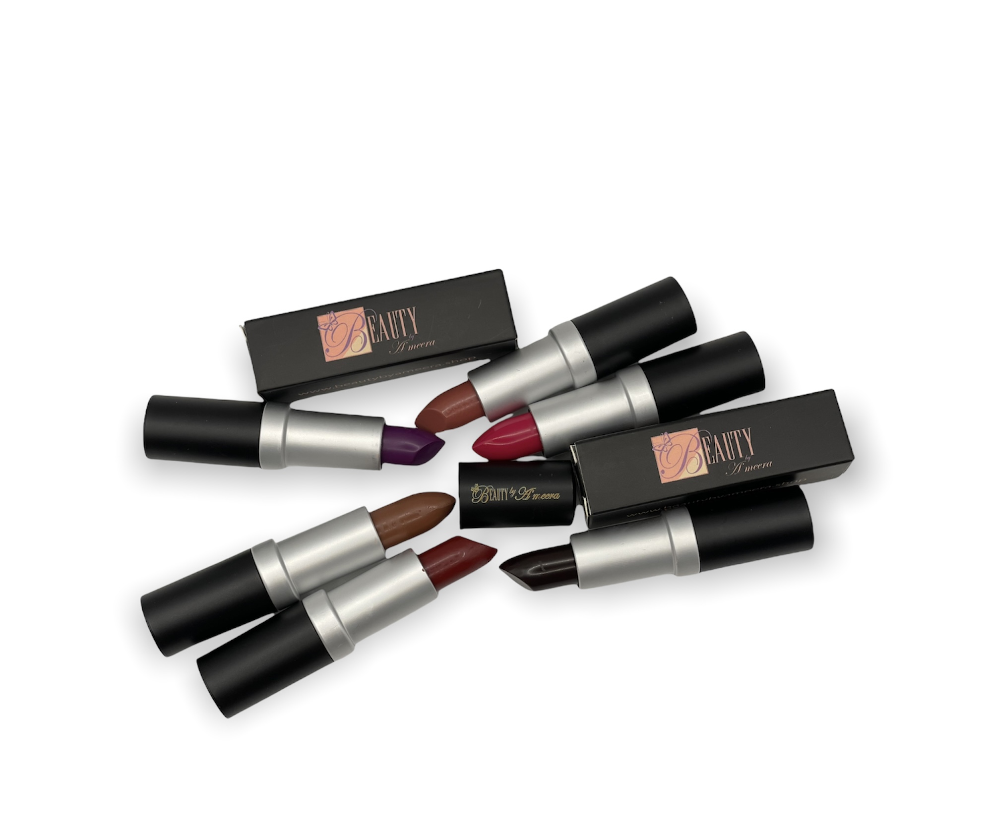 Six lipsticks with black and silver packaging, some with open caps, and two black boxes, on a white background.