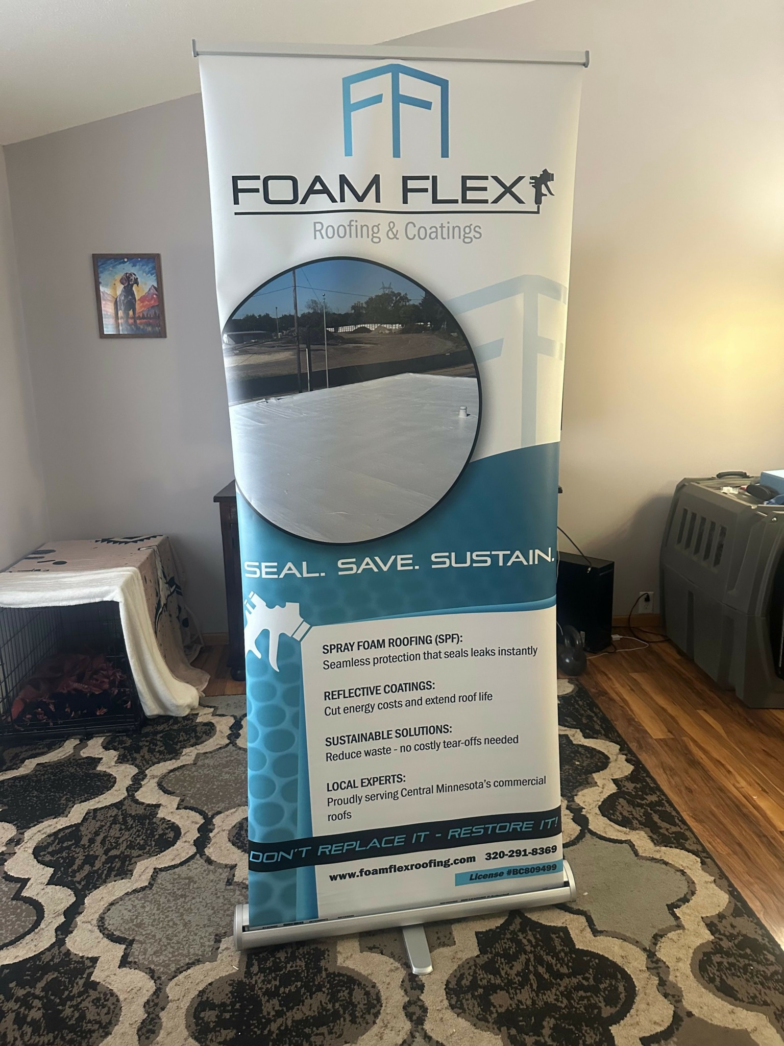Box of foam flex insulation with a circular cutout showing a view of a cityscape and water, placed on a patterned rug.