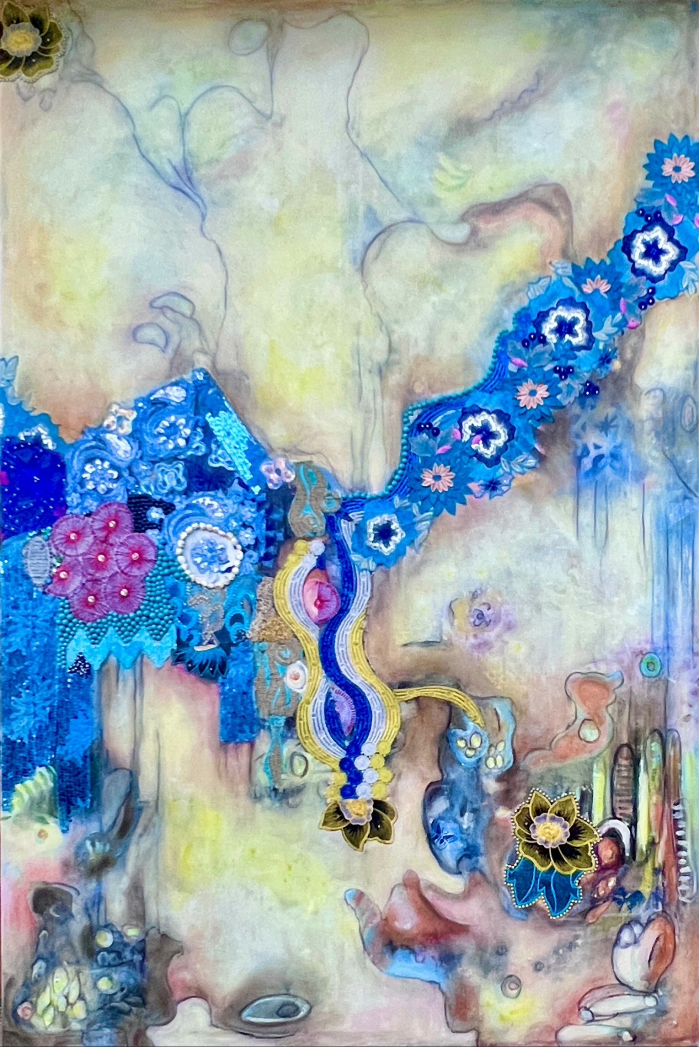 Abstract colorful artwork with faces, flowers, and patterns in blue, pink, yellow, and purple hues.