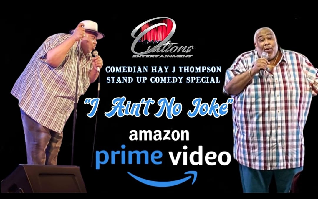 Two comedians on stage with a sign for Amazon Prime Video stand-up special titled 'Ain't No Joke'.
