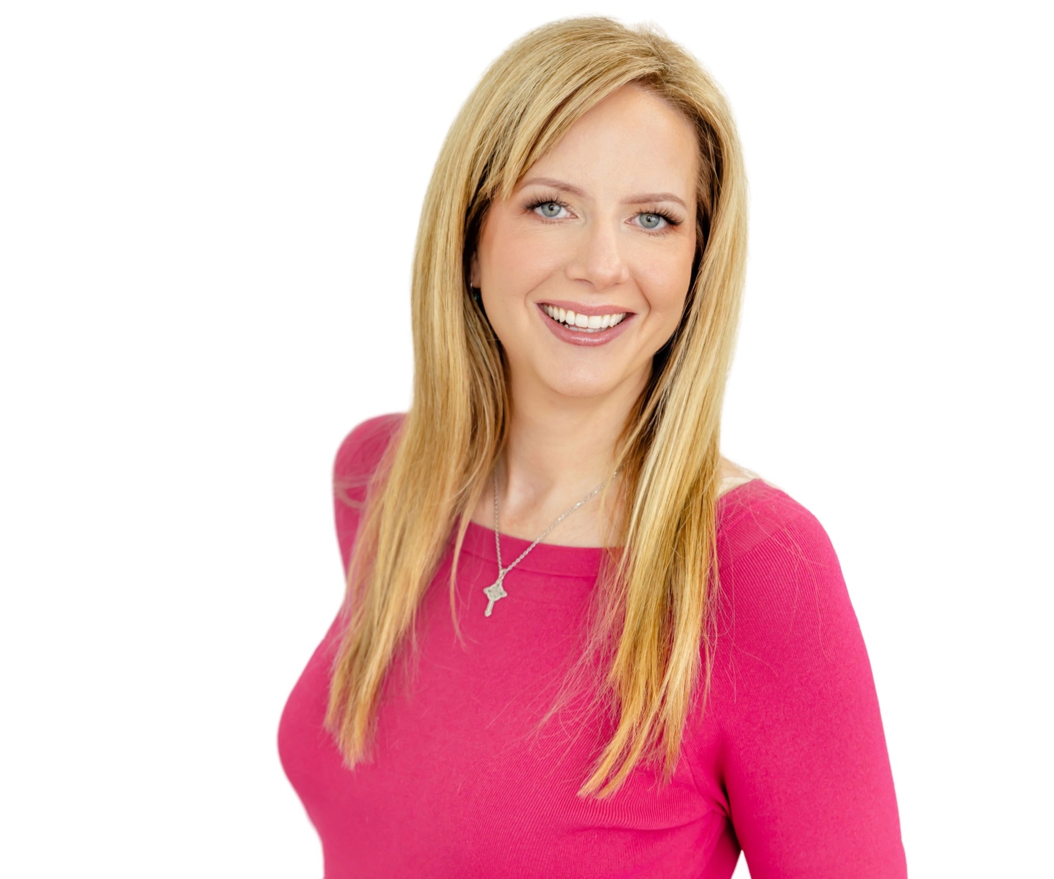 Smiling woman with long blonde hair wearing a pink top and a necklace, facing forward, white background.