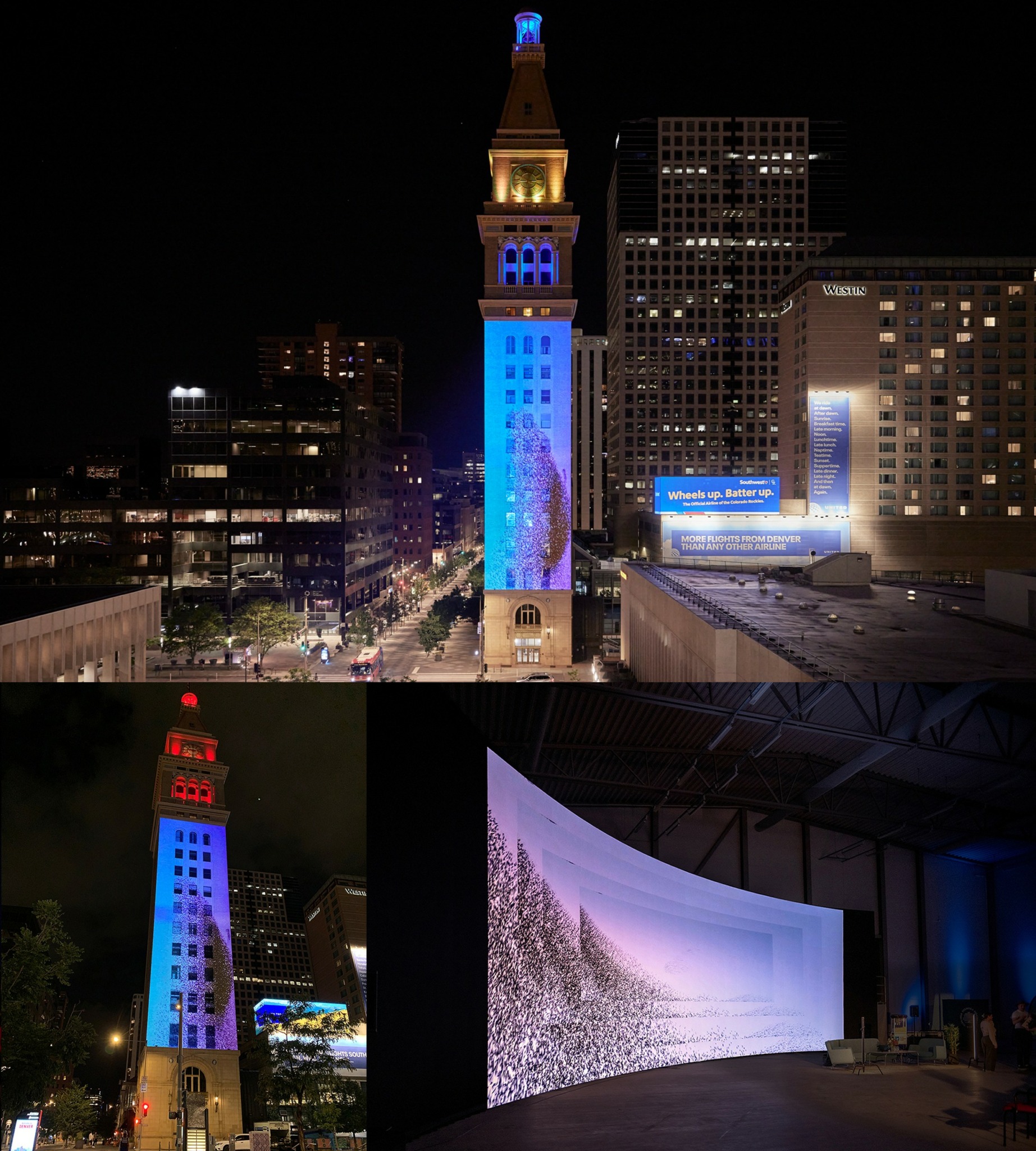 Night view of a tall clock tower illuminated in blue, with surrounding buildings and a large indoor screen displaying a starry scene.