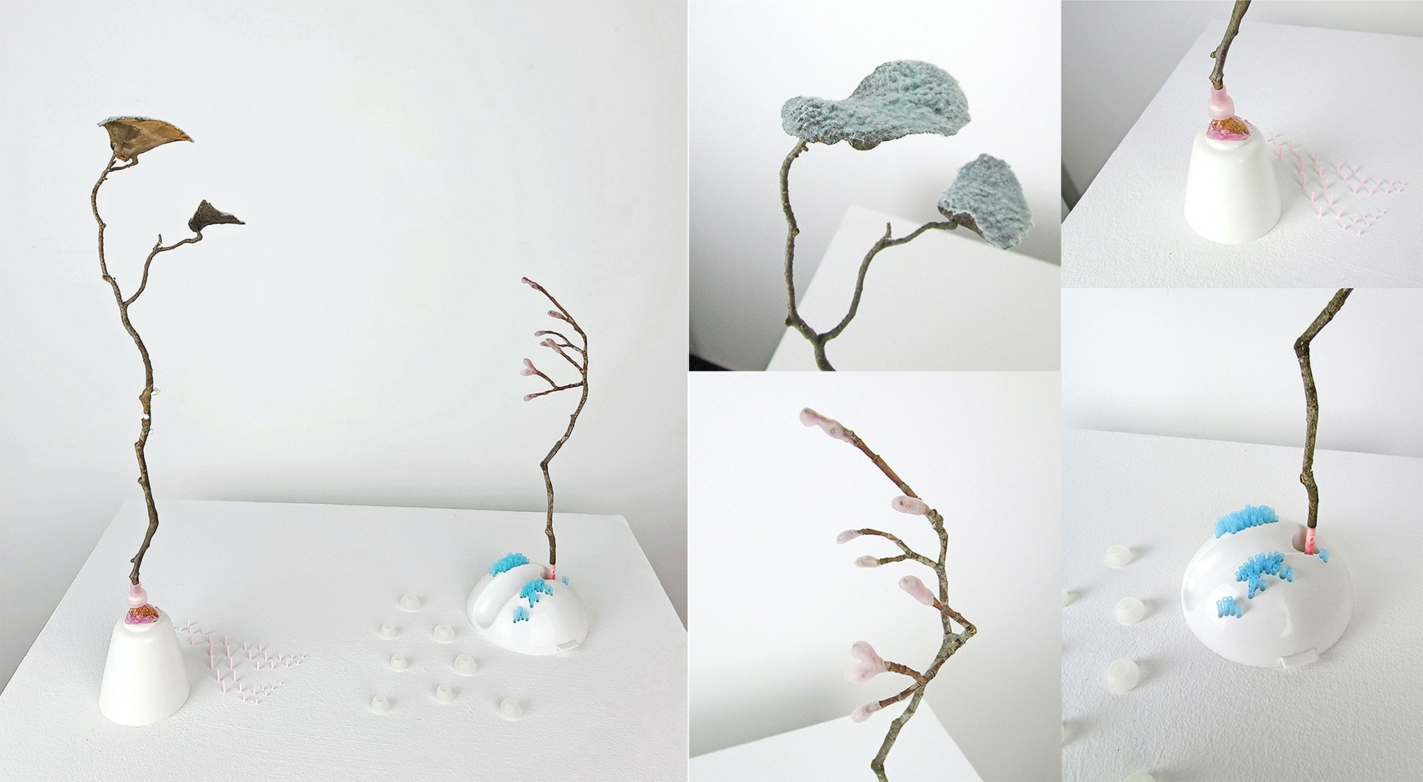 Collection of small sculptures with branches and painted elements on white backgrounds, arranged in various positions.