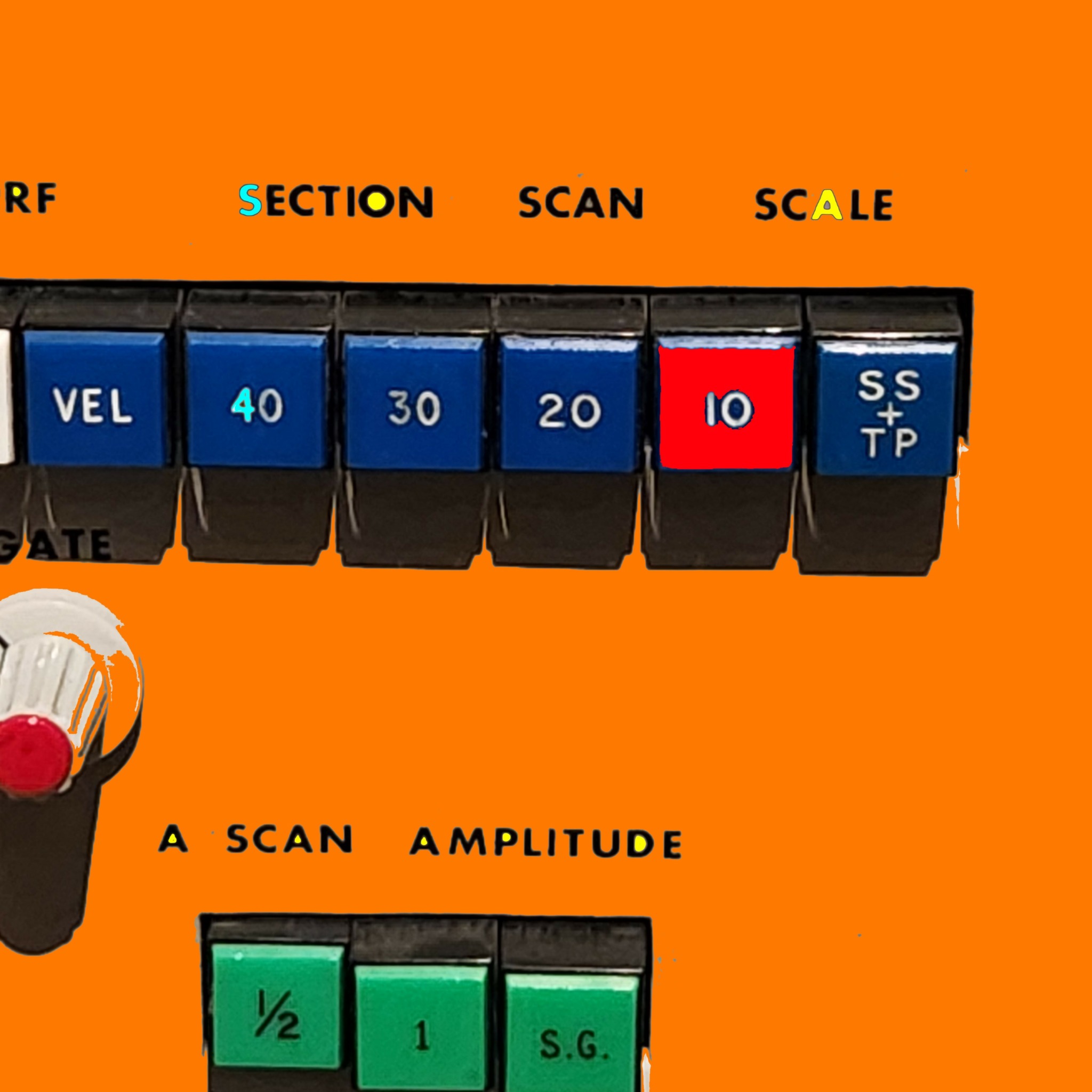 Close-up of a control panel with switches labeled with numbers and words, on an orange background.