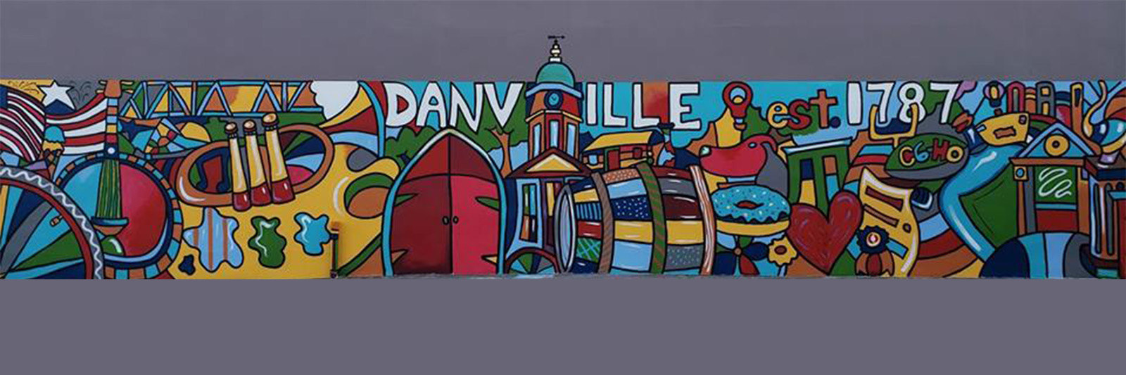 Colorful mural with abstract shapes, patterns, and text, including the words 'DANVILLE' and 'est 1787'.