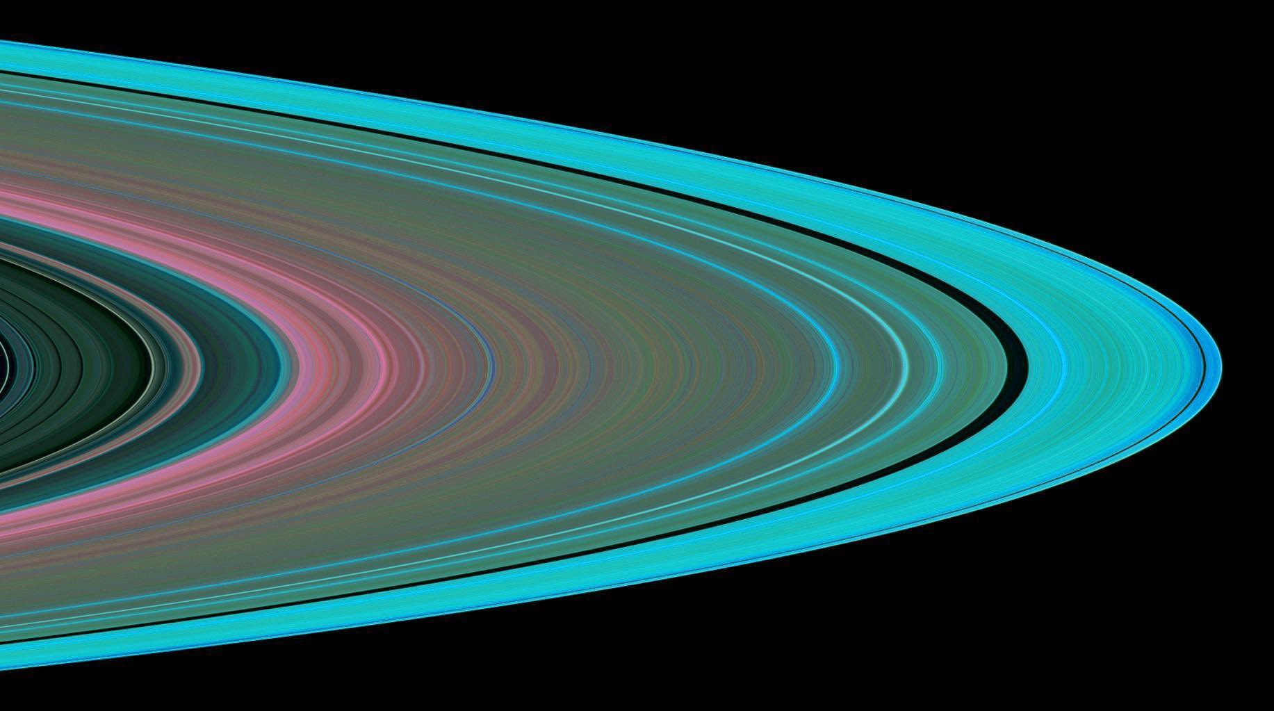 Colorful rings and lines on a black background, resembling a stylized planetary ring system or abstract design.
