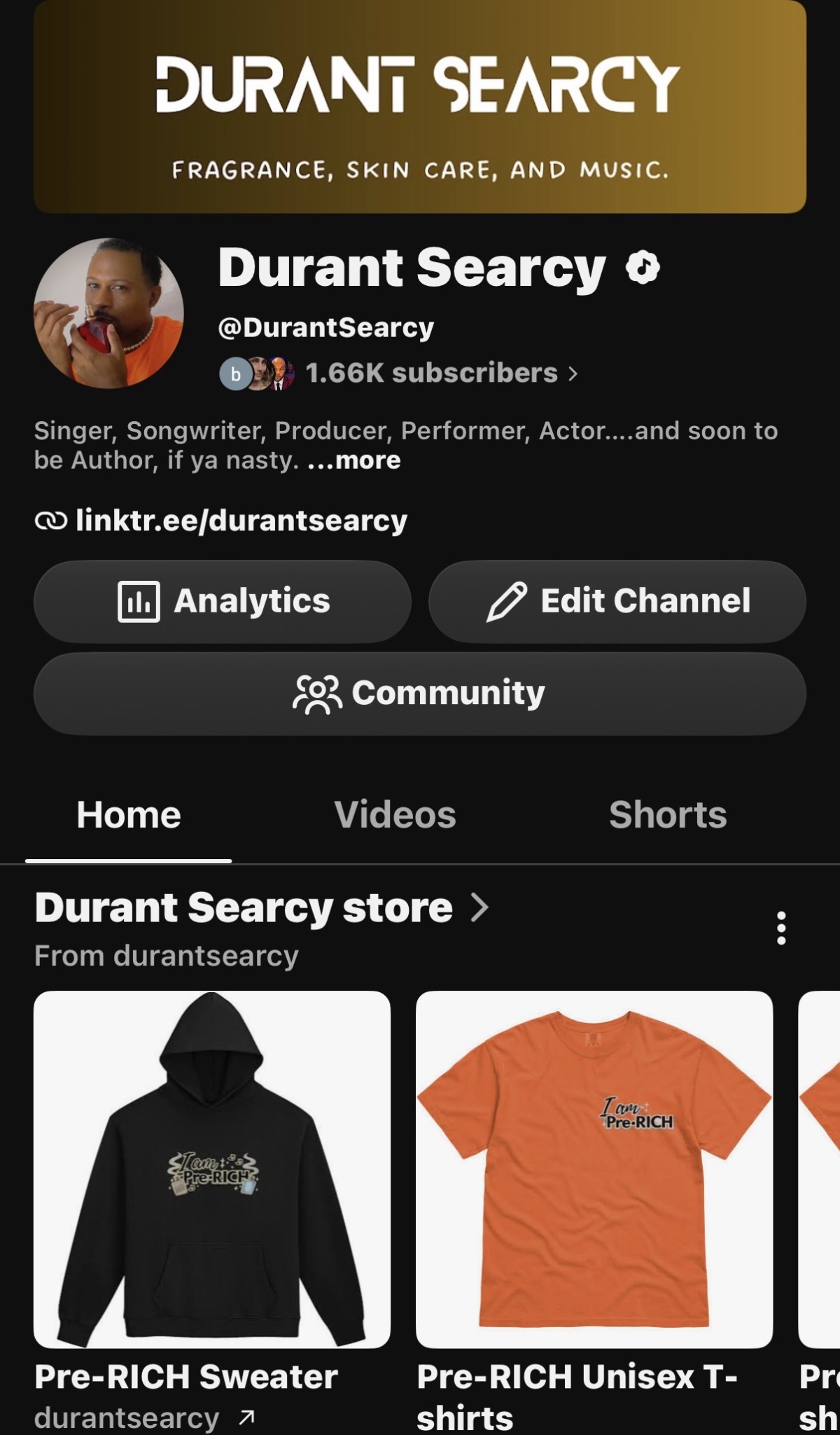 Screenshot of Durant Searcy's social media profile with profile picture, follower count, and store items including a black hoodie and orange T-shirt.