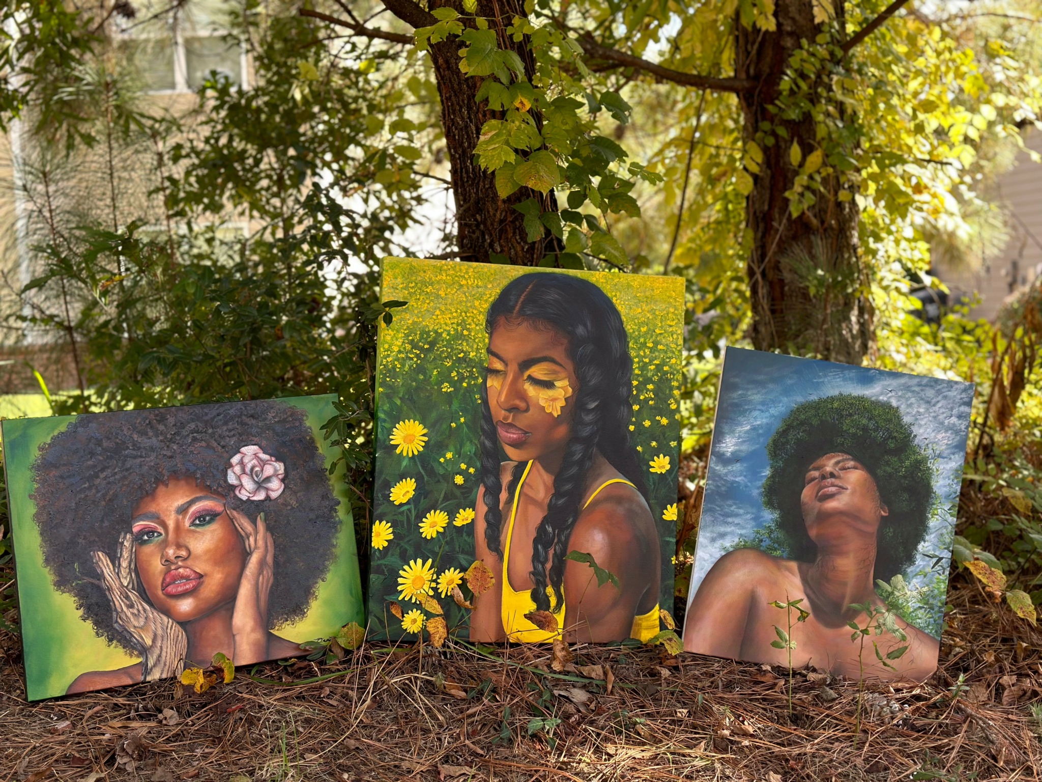 Three colorful portraits of women with natural hair outdoors, surrounded by trees and foliage.