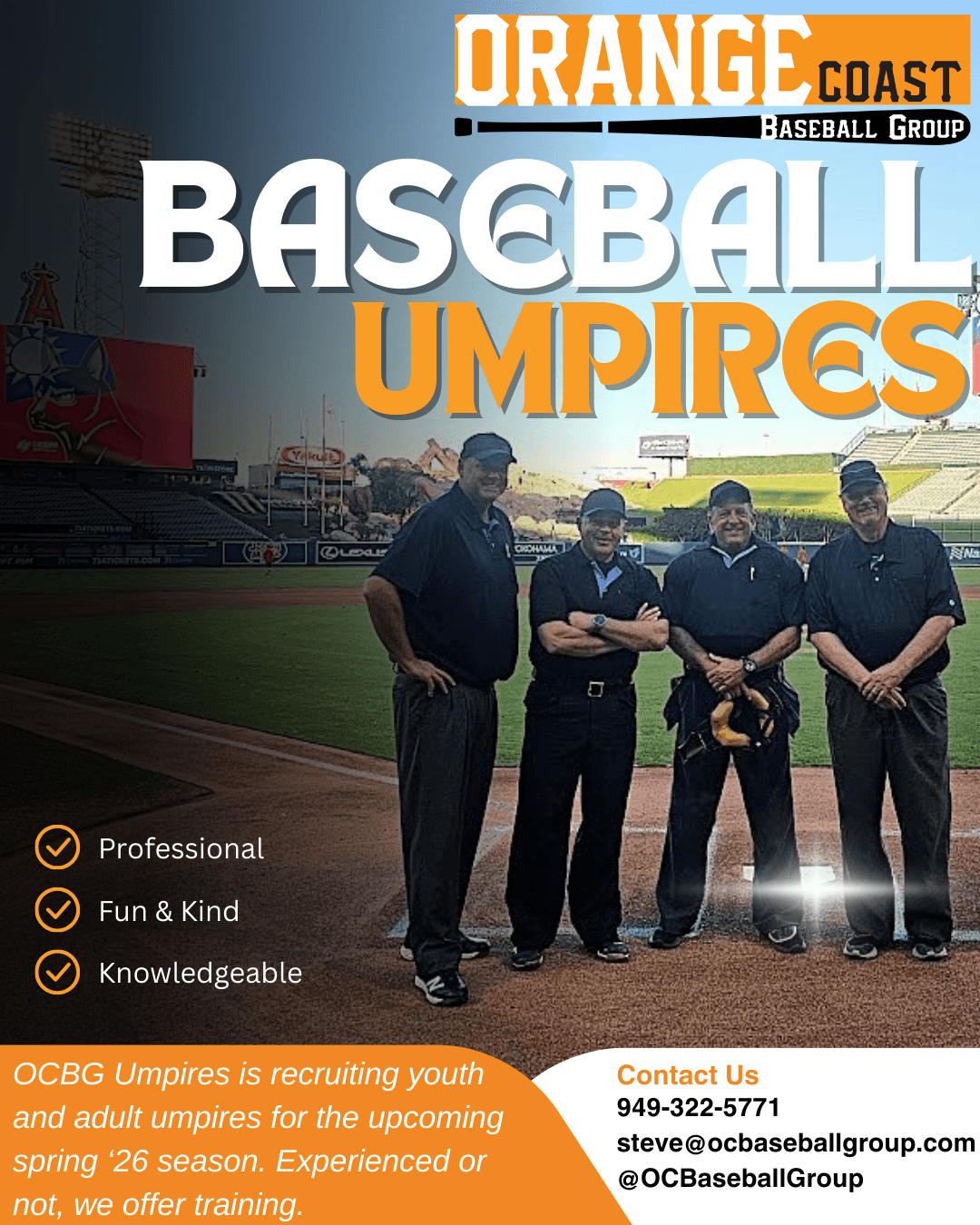 Four baseball umpires standing on a field with stadium in background, wearing black uniforms, holding equipment, smiling.