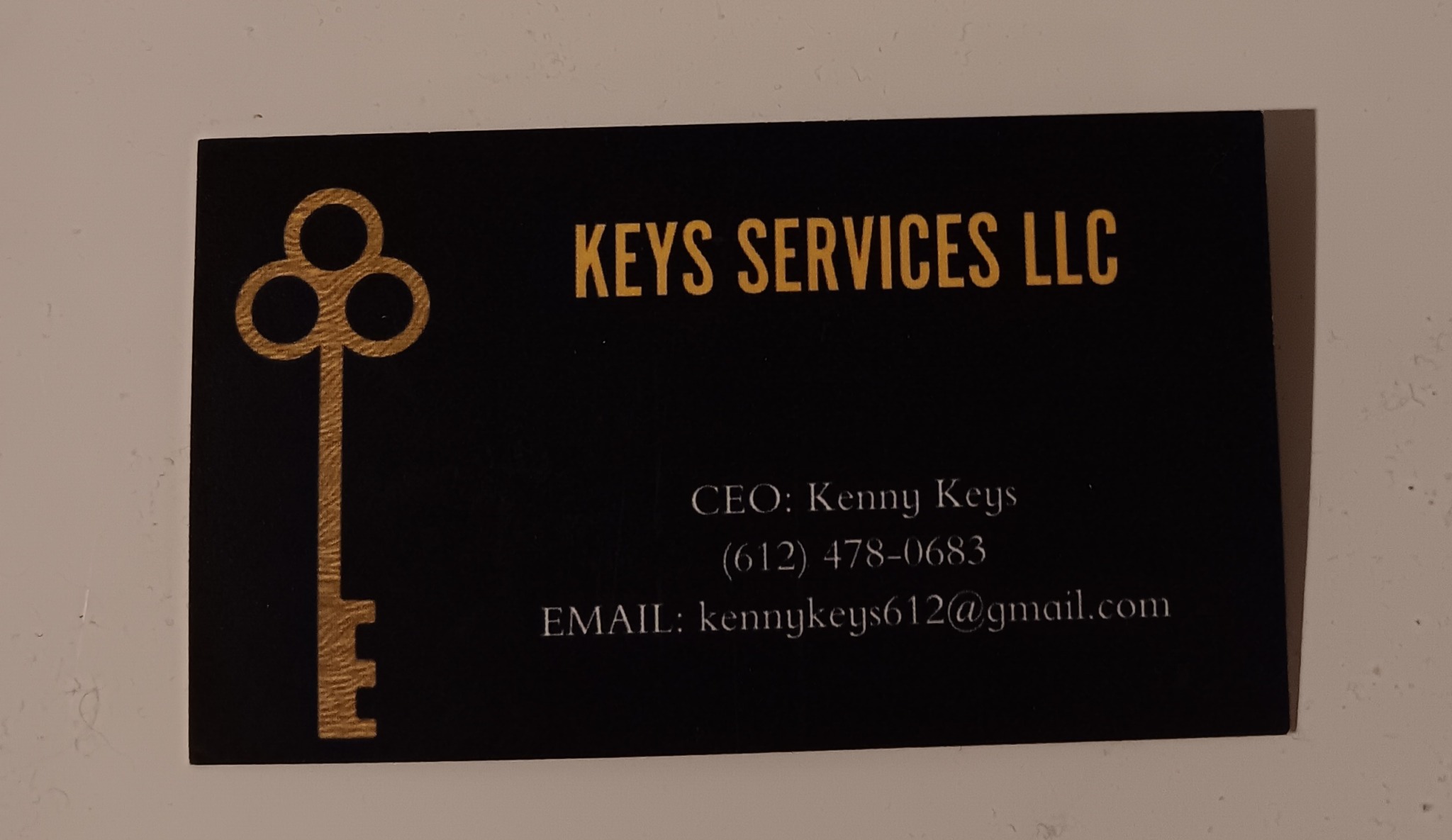 Business card for KEYS SERVICES LLC with a gold key logo, contact info, and email address.