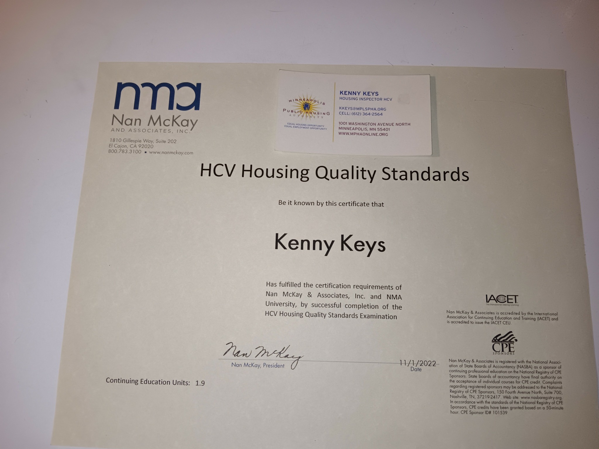 Certificate with text and logos, titled 'HCV Housing Quality Standards,' awarded to Kenny Keys, signed and dated, with a light background.