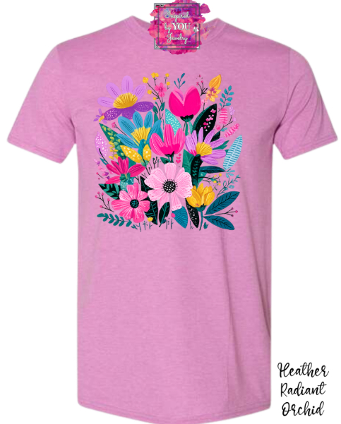 Pink T-shirt with colorful floral and heart design, short sleeves, round neckline.